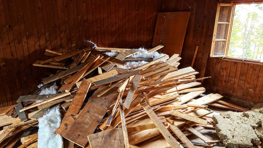 An indoor Construction Site of the Gepatschhaus with a pile of wood