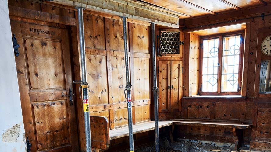 An indoor construction site of the Gepatschhaus showing wooden walls