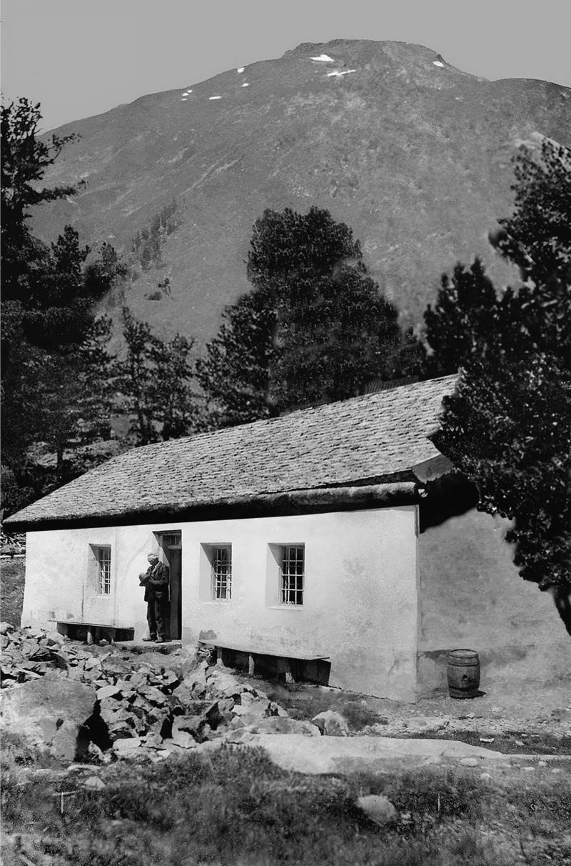 an Historic Photography of an old man standing in front of the Gepatschhaus